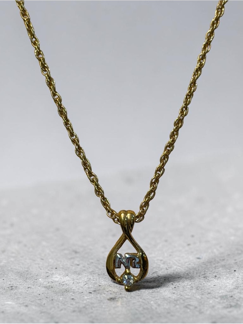 Nina Ricci Gold-Tone 'NR’ Pendant Necklace with Stone Accent